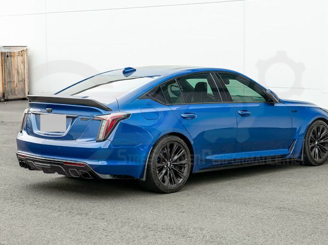 Pair of black carbon fiber mud flaps for Cadillac CT5-V Blackwing, designed to protect the front and rear splash areas.