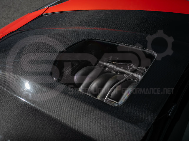 2005-2013 Chevrolet Corvette C6 | ZR1 Style Carbon Fiber Front Hood w/ Clear Window Insert