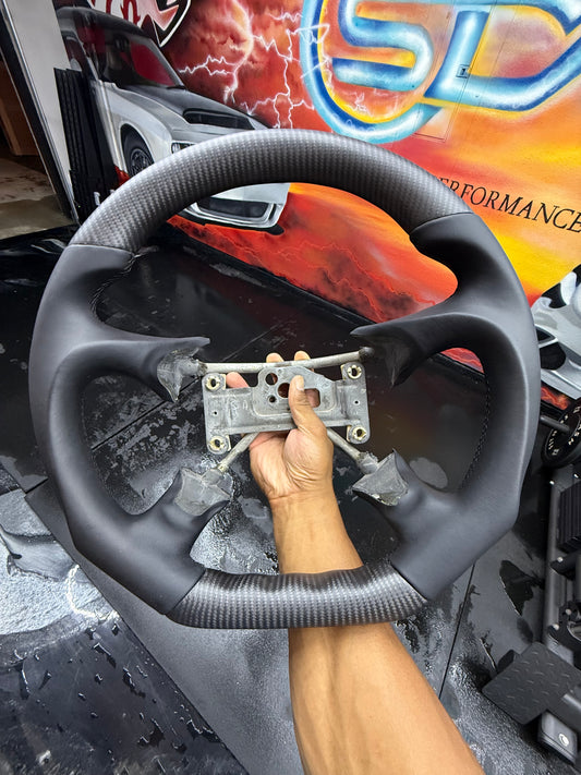 Carbon fiber steering wheel for Chevrolet Silverado, Suburban, Tahoe, Yukon, C1500, K1500 by Street Driven Performance.