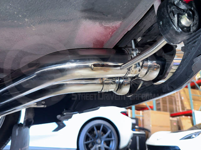 Hyundai Veloster Turbo exhaust axle back with dual 4-inch muffler delete tips, available in burnt or chrome finish, by Street Driven Performance.
