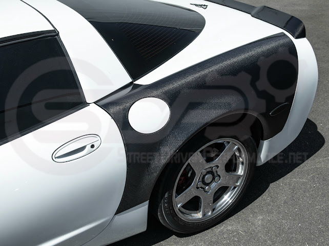 Factory style carbon fiber front and rear widebody fenders for 1997-2004 Chevrolet Corvette C5 hatchback by Street Driven Performance.