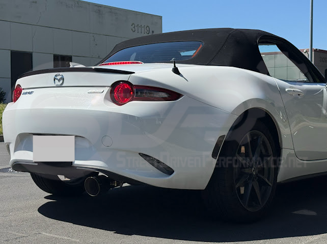 Mazda MX-5 Miata ND 2016-2025 axle back exhaust with 4-inch burnt or chrome tips, showing sleek stainless steel muffler delete design.