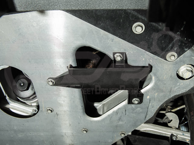 Pair of Street Driven Performance Chevrolet Corvette C8 underbody air deflector cooling duct scoops, exterior trim components.