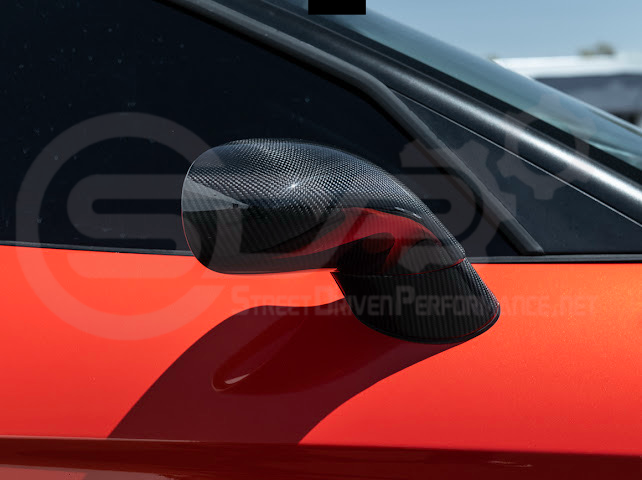 Set of four dry carbon fiber side mirror cap covers for 2005-2013 Chevy Corvette C6 by Street Driven Performance, tape-on install.