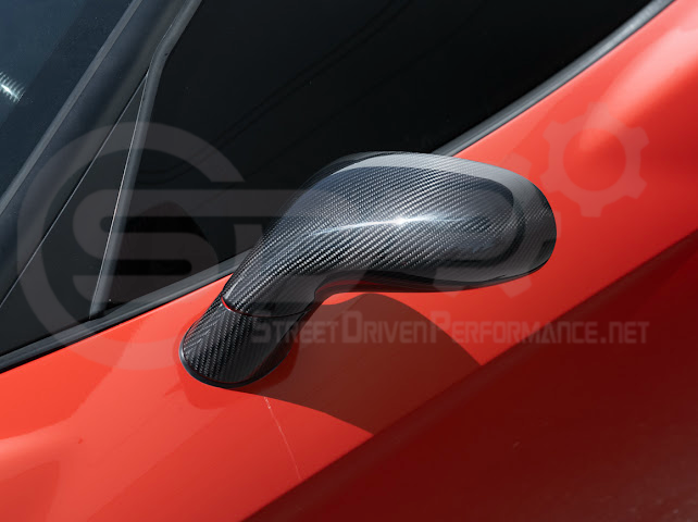 Set of four dry carbon fiber side mirror cap covers for 2005-2013 Chevy Corvette C6 by Street Driven Performance, tape-on installation.