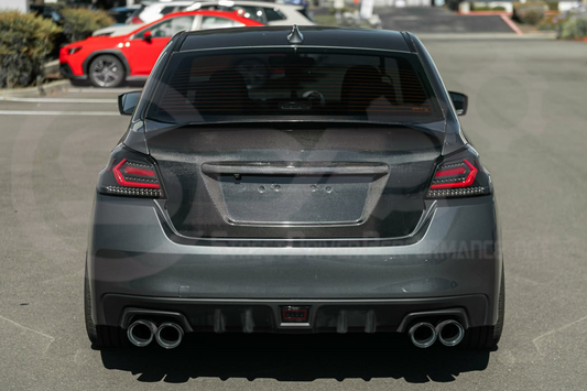Carbon fiber rear trunk lid with integrated spoiler wing for 2015-2021 Subaru WRX STI, designed for high-performance car customization.