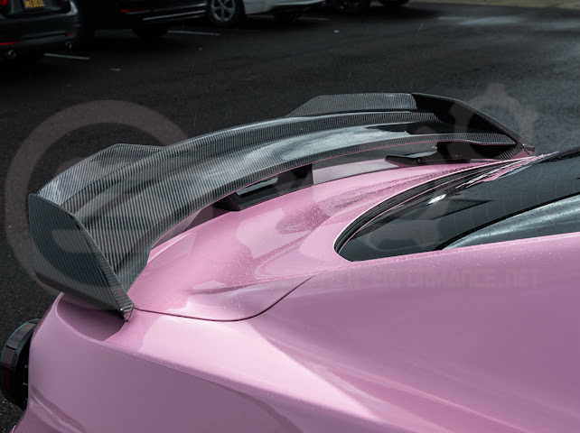 2015-2023 Ford Mustang Dark Horse style carbon fiber rear wickerbill spoiler wing, designed for sporty aerodynamic enhancement.