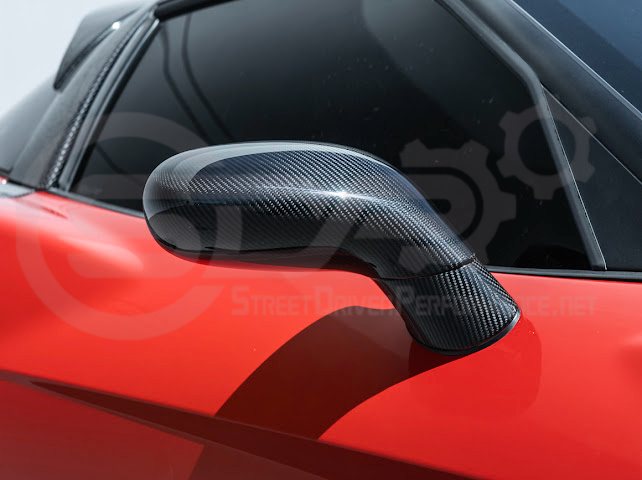 Set of four dry carbon fiber side mirror cap covers for 2005-2013 Chevy Corvette C6, tape-on style from Street Driven Performance.