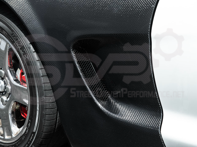 Factory style carbon fiber front and rear widebody fenders for 1997-2004 Chevrolet Corvette C5 hatchback by Street Driven Performance.