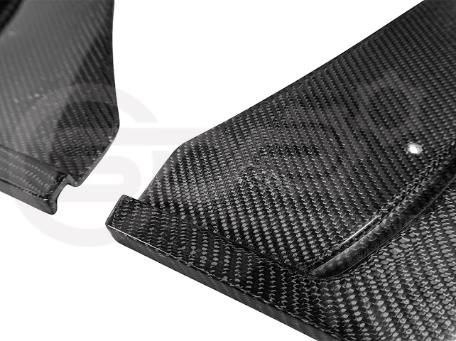 Pair of black carbon fiber mud flaps for Cadillac CT5-V Blackwing 2022 and up, designed to protect from road debris.