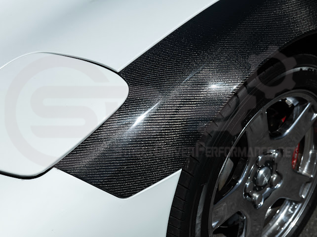 Factory style carbon fiber front and rear widebody fenders for 1997-2004 Chevrolet Corvette C5 hatchback by Street Driven Performance.