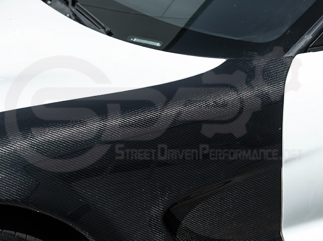 Factory style carbon fiber front and rear widebody fenders for 1997-2004 Chevrolet Corvette C5 hatchback by Street Driven Performance.