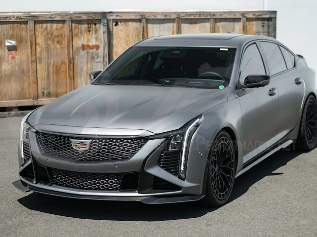 Cadillac CT5-V Blackwing factory OEM style carbon fiber front lip splitter and wheel arches, ground effects for enhanced performance.