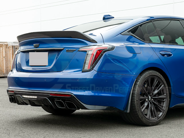 Pair of black carbon fiber mud flaps for 2022-up Cadillac CT5-V Blackwing by Street Driven Performance, splash guards for front and rear.