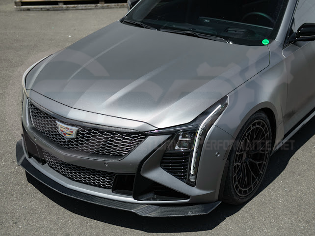 Cadillac CT5-V Blackwing factory OEM style carbon fiber front lip splitter and wheel arches, ground effects for enhanced sporty appearance.
