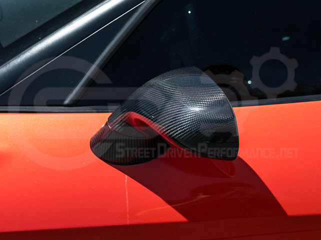 Set of four dry carbon fiber side mirror cap covers for 2005-2013 Chevy Corvette C6, tape-on style, by Street Driven Performance.