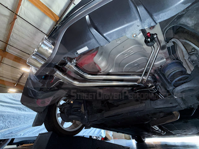 Hyundai Veloster Turbo exhaust axle back with dual 4-inch tips, available in burnt or chrome finish, by Street Driven Performance.