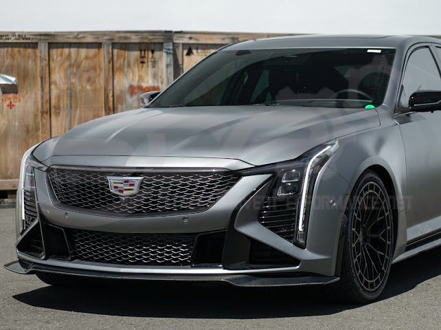 Cadillac CT5-V Blackwing factory OEM style carbon fiber front lip splitter and wheel arches, ground effects, on a sleek black car