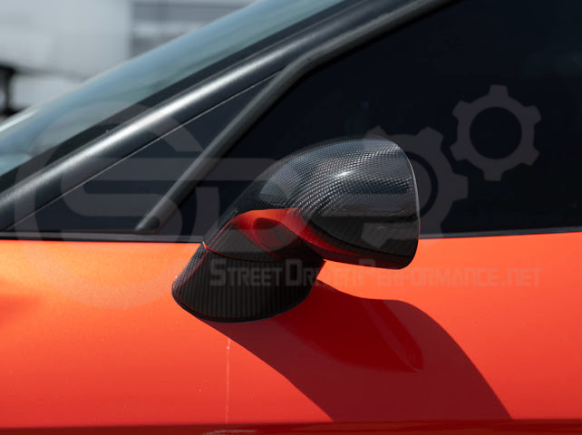 Set of four dry carbon fiber side mirror cap covers for 2005-2013 Chevy Corvette C6, tape-on style by Street Driven Performance.