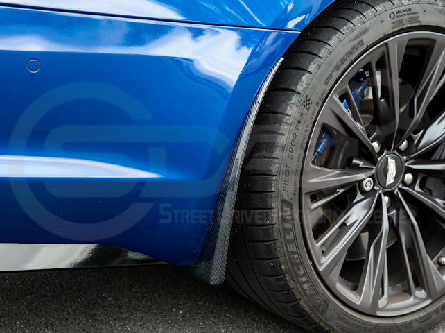 Pair of carbon fiber mud flaps for 2022-up Cadillac CT5-V Blackwing, Street Driven Performance splash guards installed on front and rear.