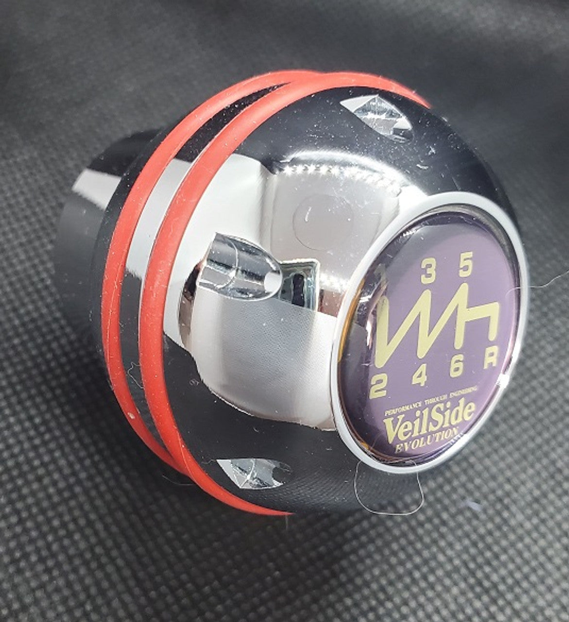 VeilSide Universal Mazda 3, 6, Miata, RX7 & RX8, Nissan S13, S14, S15, Z33, Z34, Celica, MR2 & MRS Shift Knob Type R II With Red O-Ring..Material: T6061 Aluminum..Size: 2.5"/ 6.35cm tall..Made in Japan