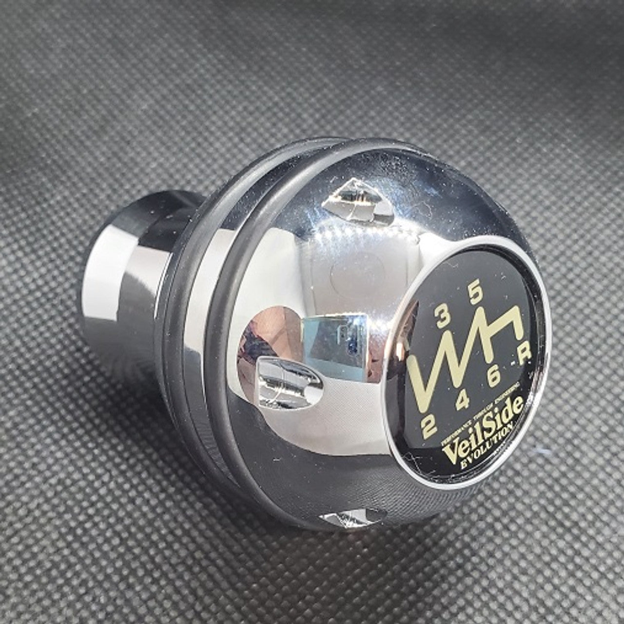 VeilSide Universal Mazda 3, 6, Miata, RX7 & RX8, Nissan S13, S14, S15, Z33, Z34, Celica, MR2 & MRS Shift Knob Type R II With Black O-Ring..Material: T6061 Aluminum..Size: 2.5"/ 6.35cm tall..Made in Japan