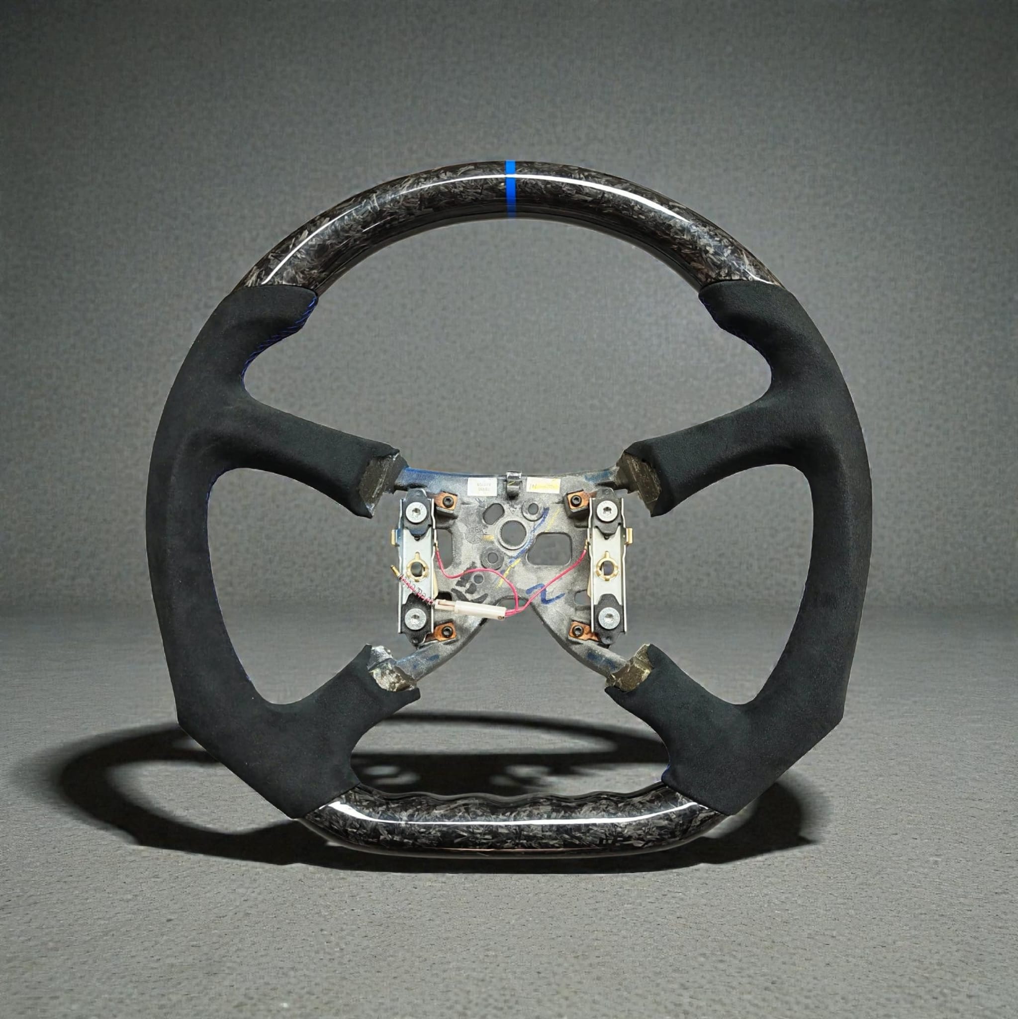 Custom carbon fiber steering wheel for 1999-2002 Chevrolet Suburban 1500 & 2500 without built-in buttons, by Street Driven Performance.