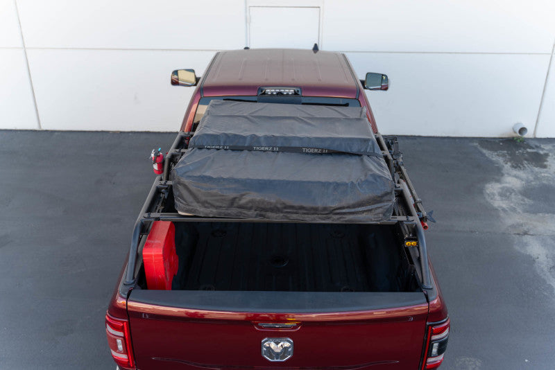 DV8 Offroad MTO Series Bed Rack for Toyota Tundra and Ford F150 Raptor, adjustable 2-piece exterior truck bed accessory.