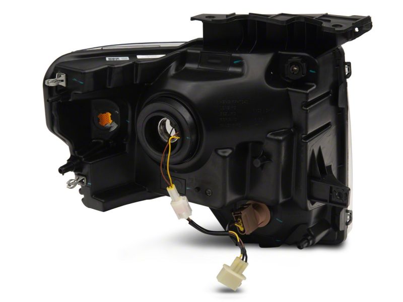Raxiom 09-14 Ford F-150 Axial Series Headlight w/ SEQL LED Bar- Black Housing (Clear Lens)