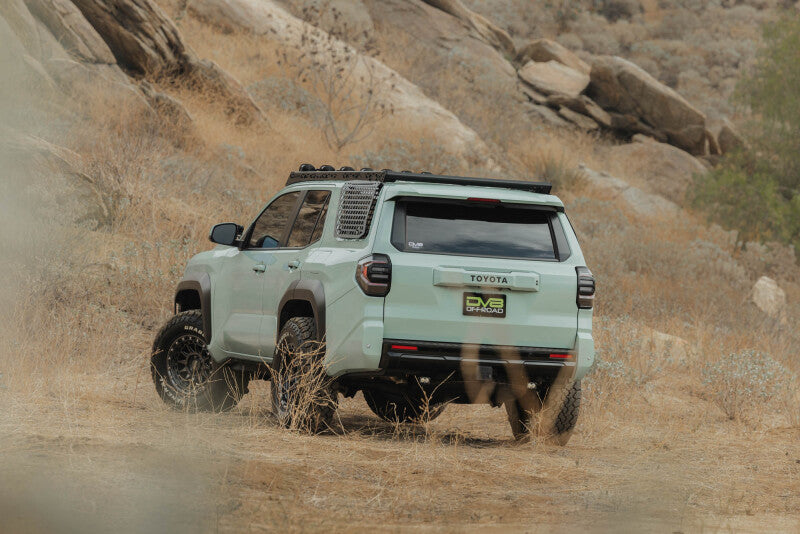 DV8 Offroad Toyota 4Runner exterior window Molle panel for DV8 roof rack, driver side, mounted on vehicle window trim.