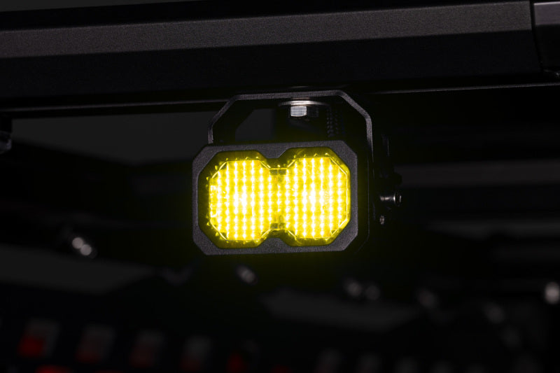 Diode Dynamics Stage Series LED chase light kit with multiple light bars for Kuat IBEX bed rack, mounted on a vehicle.