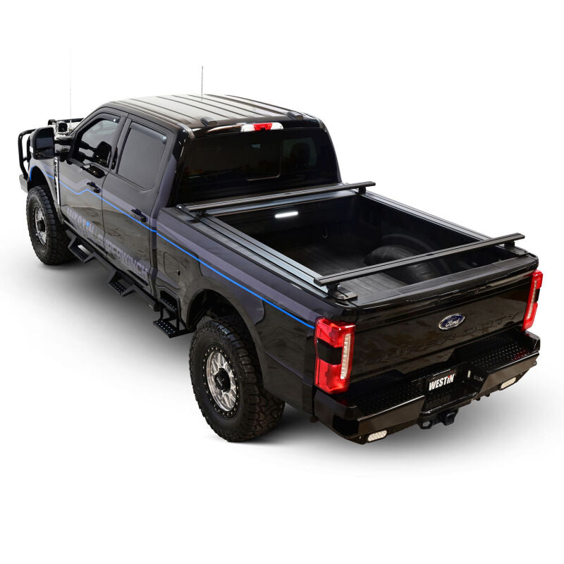 Westin retractable tonneau cover in black for Ford F-250/F-350 SD 6.8ft bed, designed for secure truck bed protection.