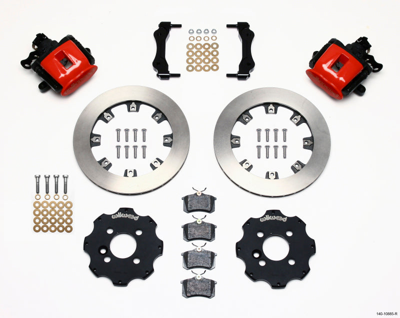 Wilwood rear parking brake kit with red calipers installed on a Mini Cooper, showing 11.75-inch performance brake calipers.