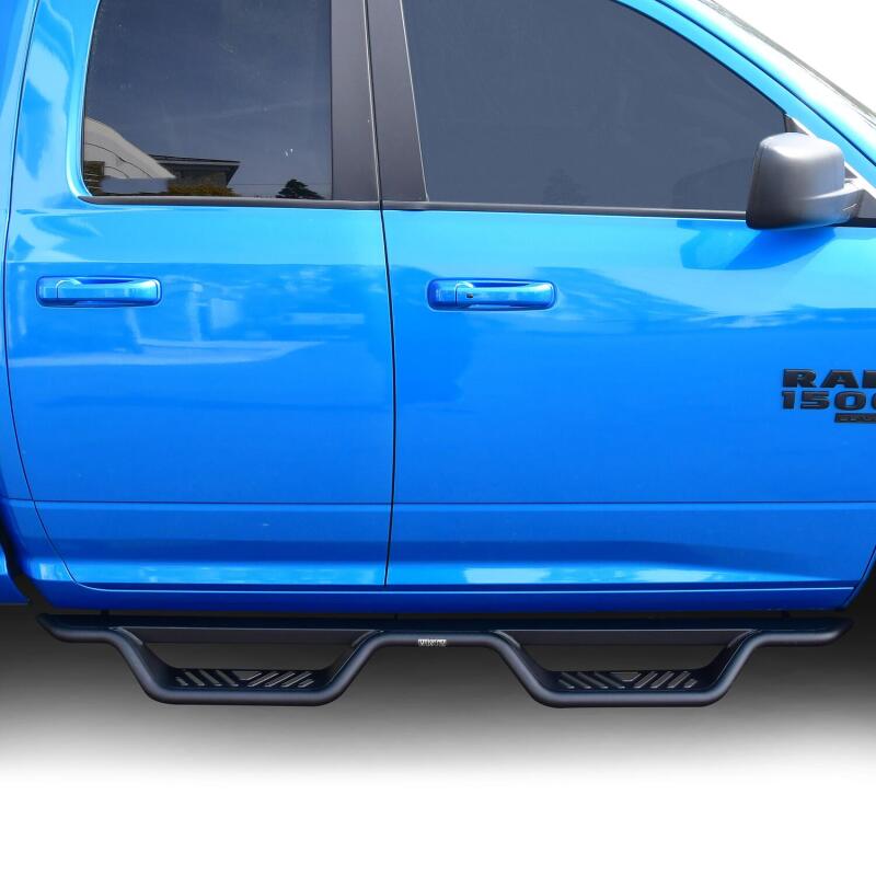Westin Outlaw Drop Nerf Step Bars in textured black on Ram 1500 Quad Cab/Classic truck, showing side view with step features