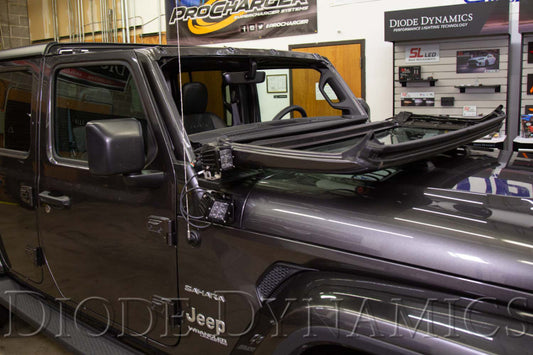 Diode Dynamics Jeep JL Wrangler/Gladiator cowl mount LED bracket kit with light bars and cubes installed on vehicle hood.