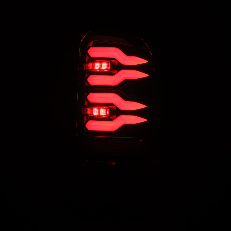 AlphaRex LUXX-Series LED tail lights for Dodge Ram 1500/2500/3500 in Alpha-Black finish, showcasing sleek, modern design.