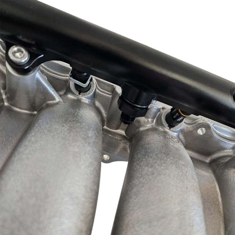BLOX Racing Honda K-Series Xtreme aluminum fuel rail in black, showcasing its sleek design and mounting points for performance fuel delivery