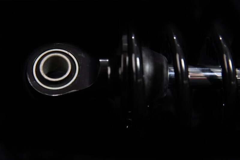 Ohlins Blackline shock absorber for Harley-Davidson FL Touring 2006-2022, showing the sleek black design and mounting hardware.