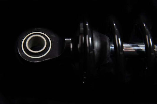 Ohlins Blackline shock absorber for Harley-Davidson FL Touring 2006-2022, showing the sleek black design and mounting hardware.
