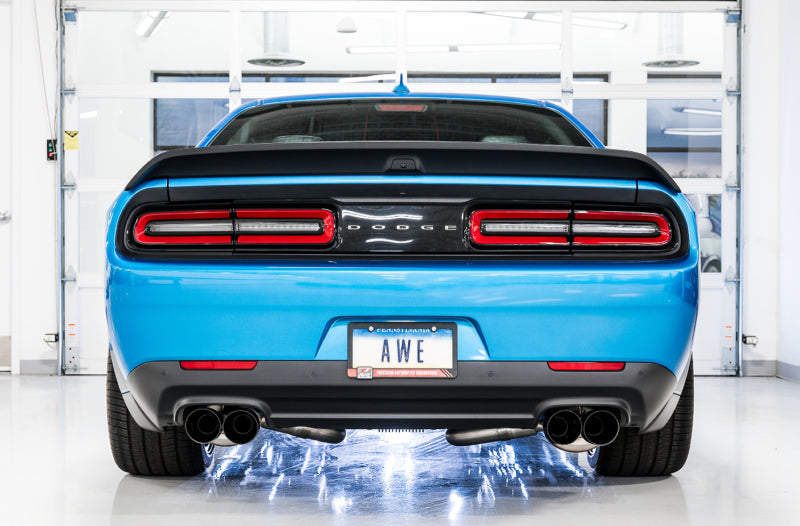 AWE Tuning catback exhaust system with quad diamond black tips for 2015+ Dodge Challenger 6.4L/6.2L SC Track Edition, showing the tips and piping.