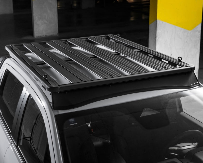 Rival 4x4 aluminum roof rack for Ford Ranger and Ranger Raptor, mounted on vehicle, sturdy and lightweight for carrying gear.