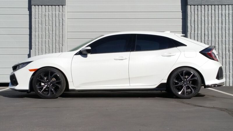 HKS HIPERMAX S FK7 coilover suspension kit installed on a car, showing adjustable shock absorbers and coil springs.