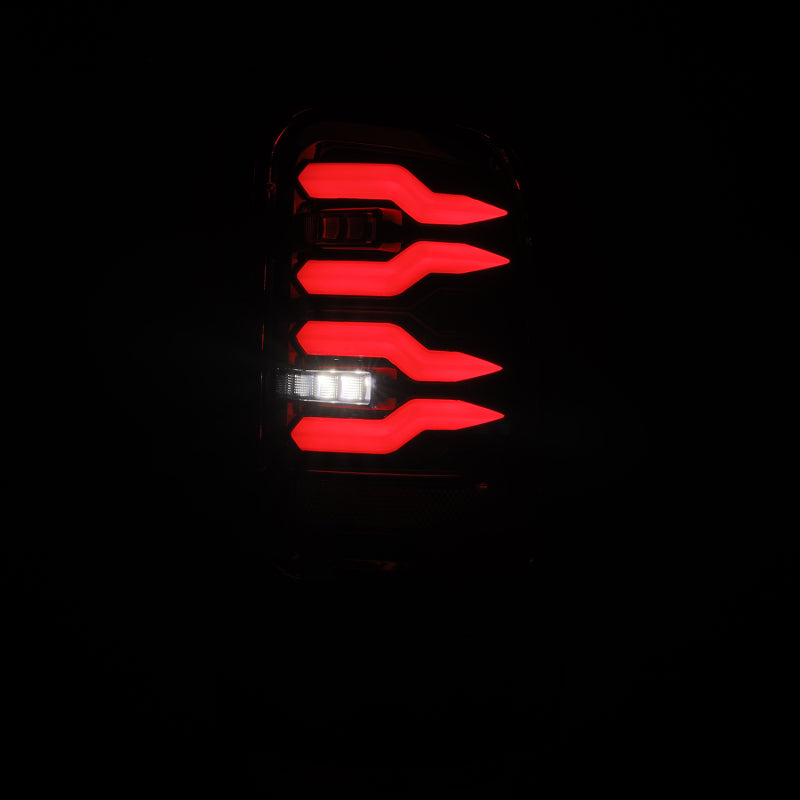 AlphaRex LUXX-Series LED tail lights for Dodge Ram 1500/2500/3500 in Alpha-Black, showing sleek black design and bright LED accents.