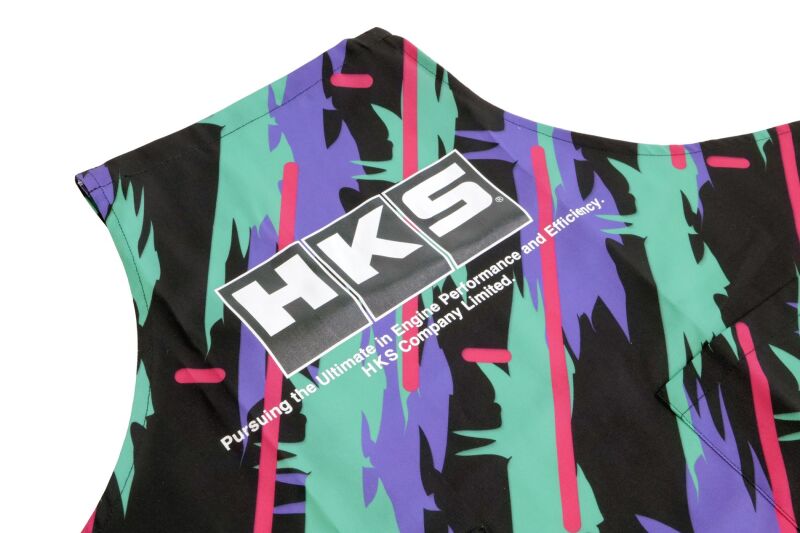 HKS apron shirt in oil color, featuring a casual design with front pockets and adjustable straps, branded with HKS logo.