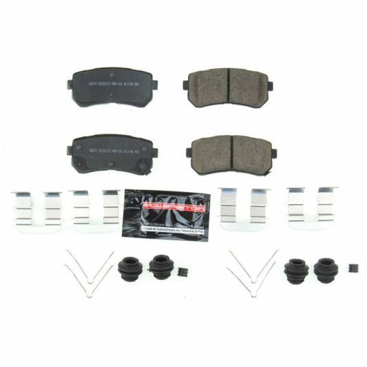 PowerStop Z23 Evolution sport rear brake pads with hardware installed on a Hyundai Kona, showcasing high-performance brake components.