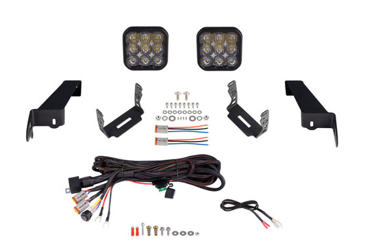 Diode Dynamics Jeep JL SS5 CrossLink bumper lightbar kit with sport driving lights mounted on a Jeep JL vehicle.