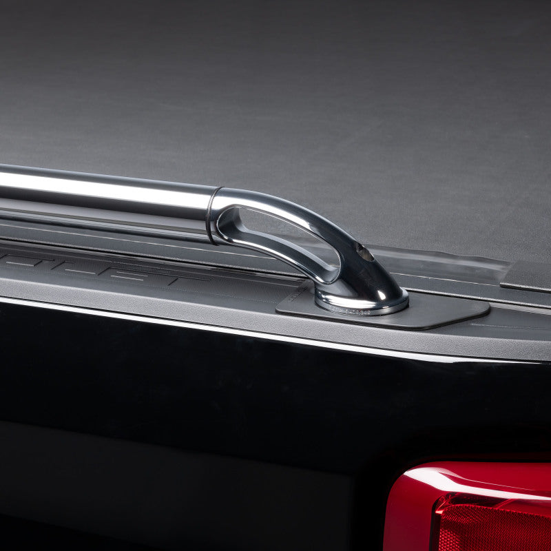 Putco black powder-coated 6.5ft bed locker side rails on Toyota Tundra exterior body armor and rock rails.