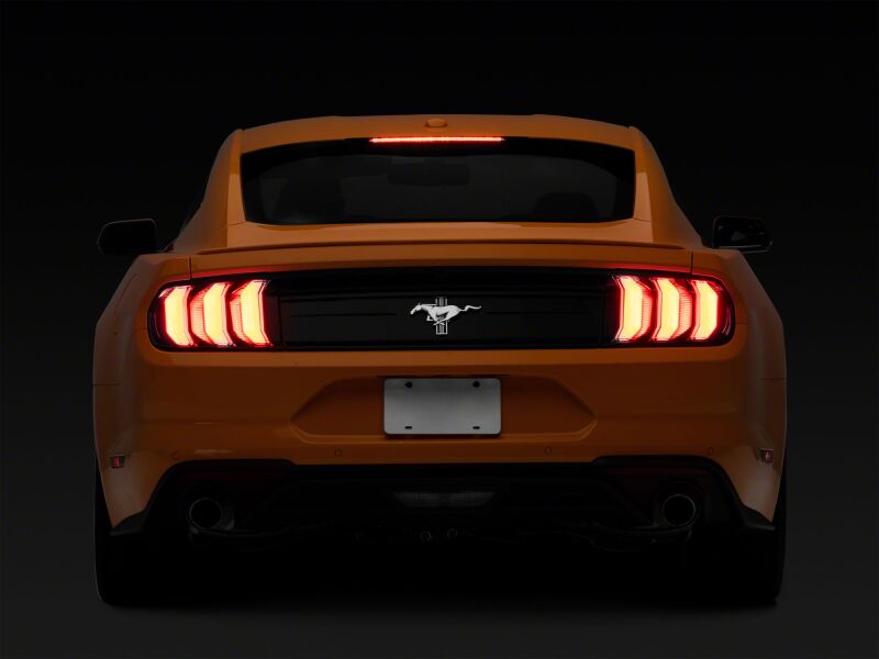 Raxiom Ford Mustang Euro Style LED tail lights with gloss black housing and red lenses for 2015-2023 models.