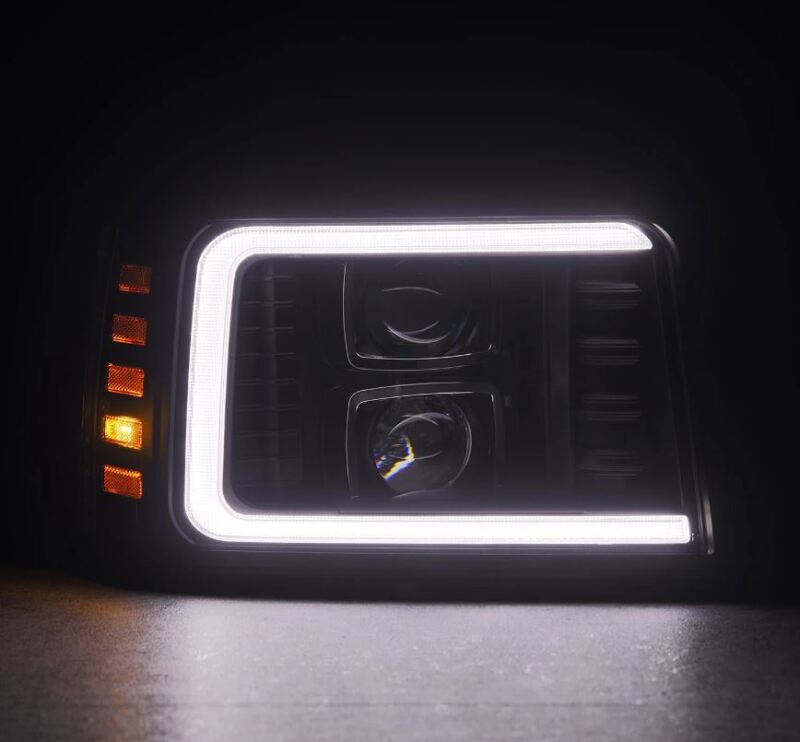 AlphaRex PRO-Series projector headlights for 92-96 Ford F-Series and Bronco with black housing, sequential signal, and daytime running lights.