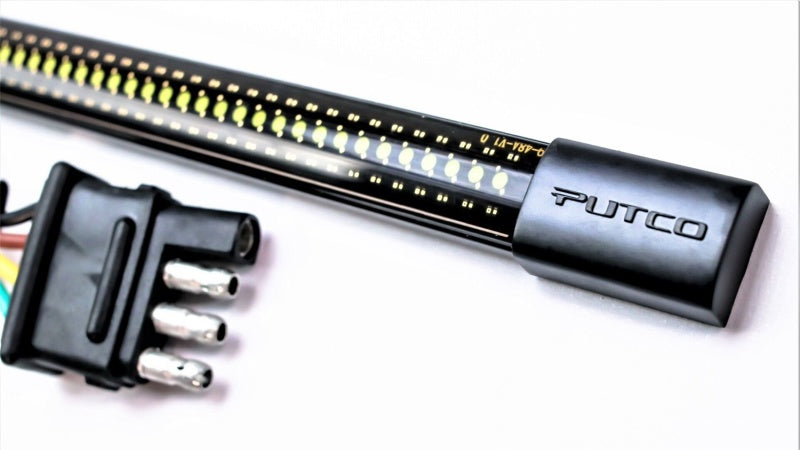 Putco 17-19 Ford Super Duty 60-inch amber LED tailgate light bar with quick-connect harness installed on truck.